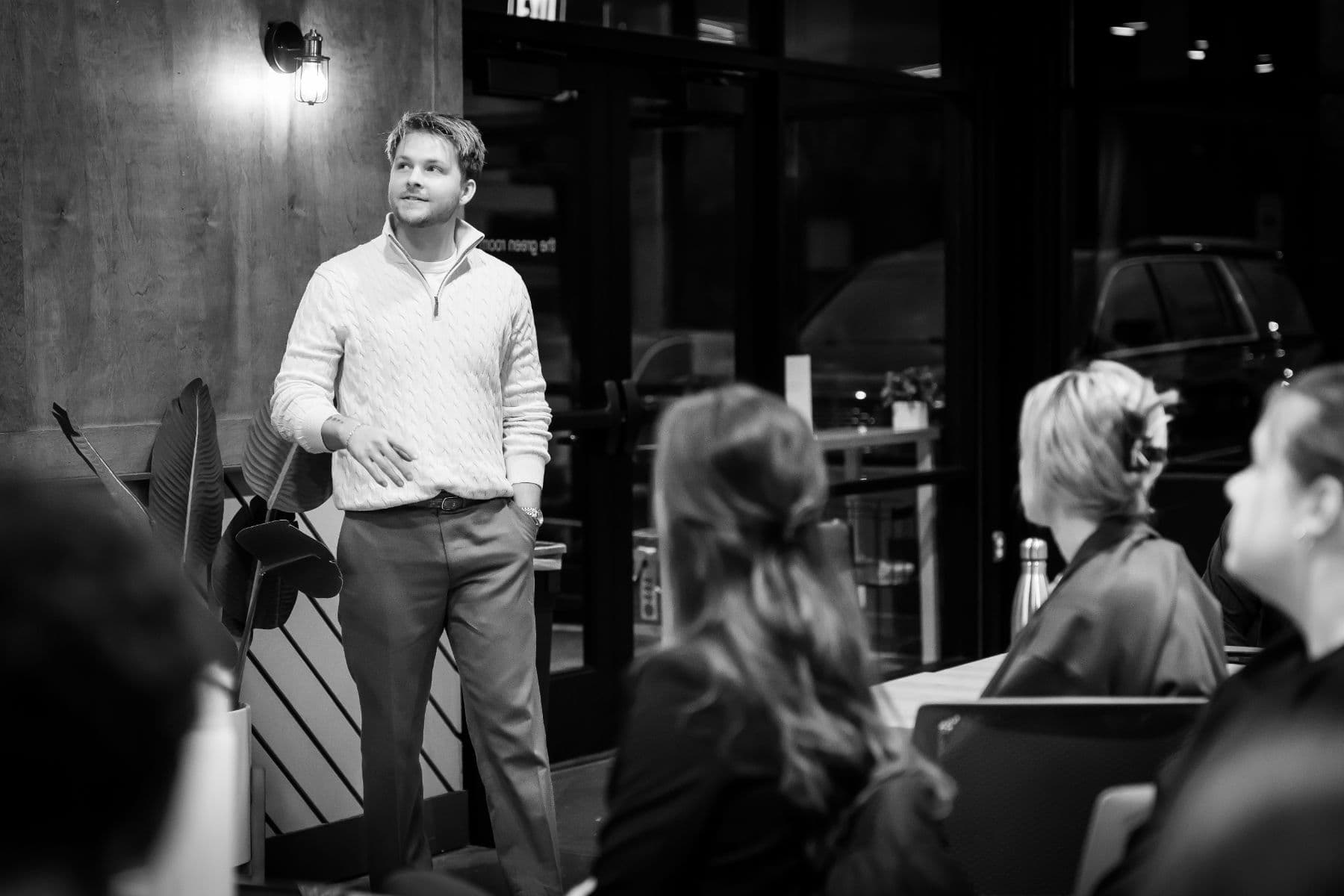 A Hive member addressing the room